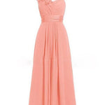 Peach-colored one-shoulder dress with floral detail on a white background