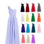 Collection of colorful dresses displayed against a white background