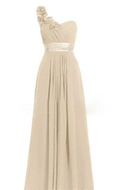 Beige one-shoulder dress with floral details on a white background