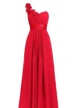 Red evening gown with floral detail on a white background